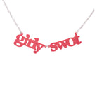 Girly Swot necklace in sunset pink shown hanging against a white background.