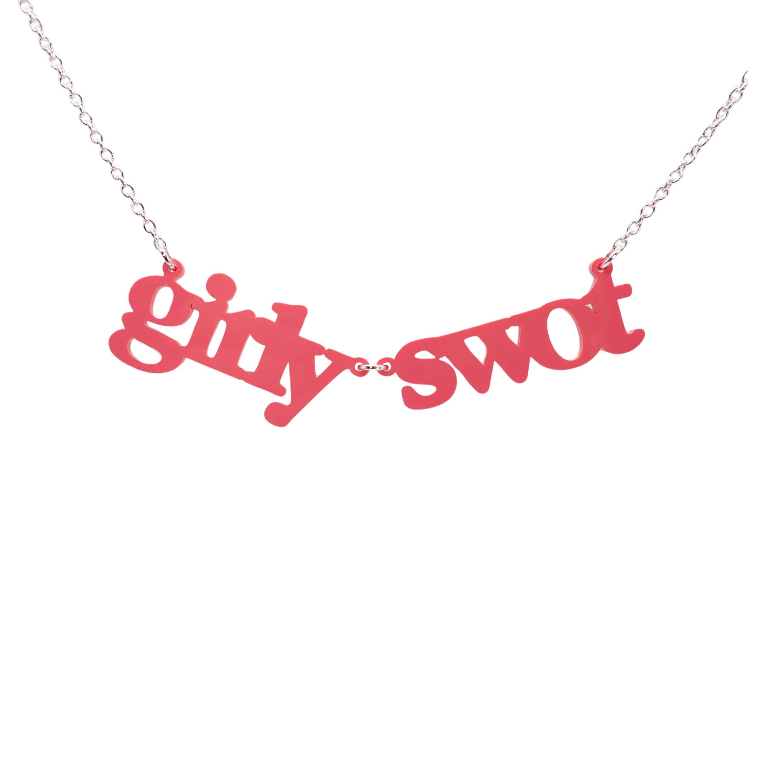 Girly Swot necklace in sunset pink shown hanging against a white background.