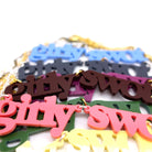 A close up of the different colours of Girly Swot necklaces