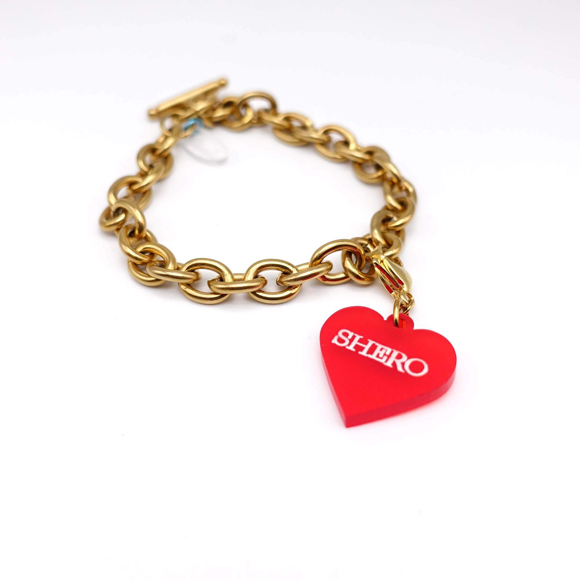 Gold PVD vacuum plated charm bracelet with a red Shero charm.