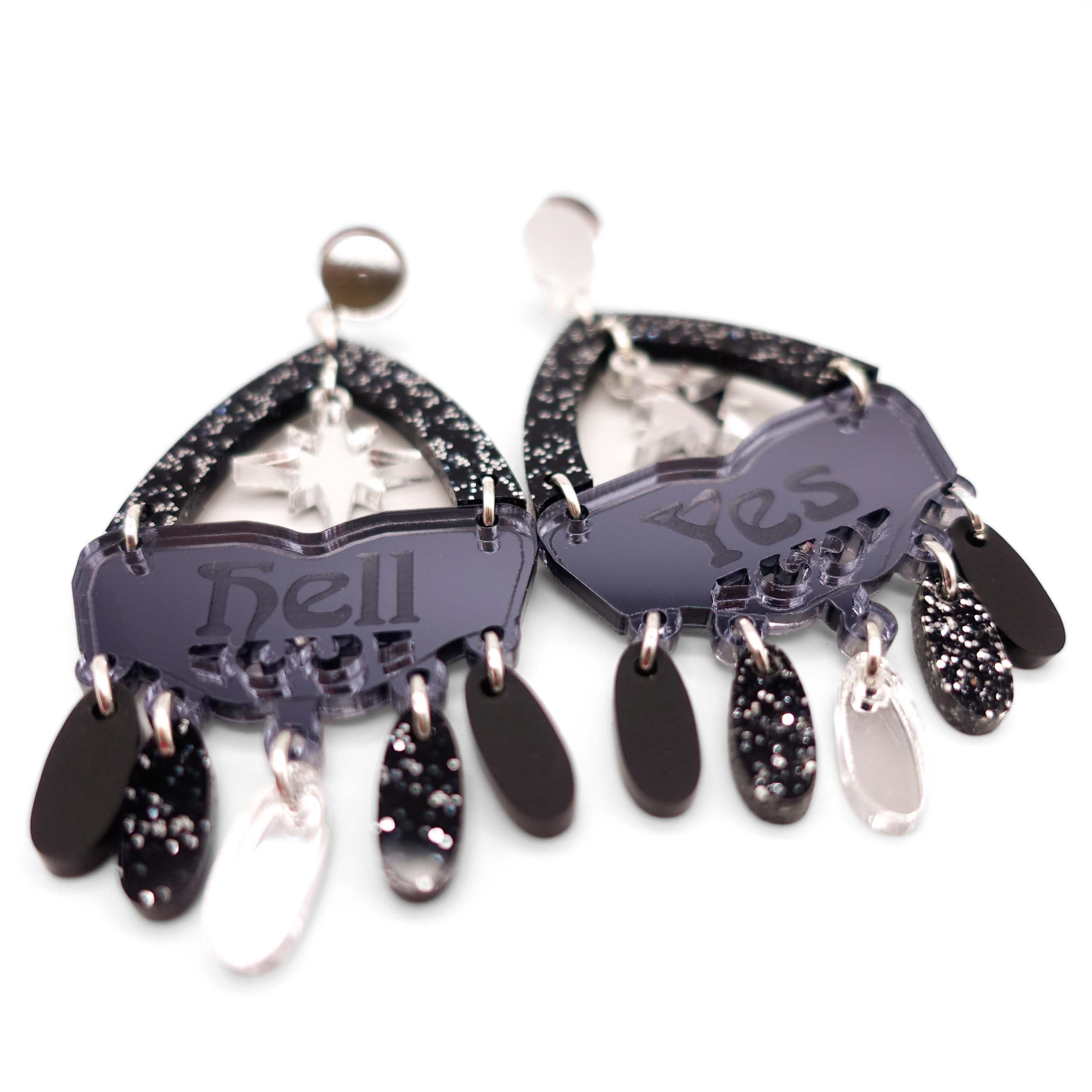 Western style Hell Yes statement earrings in black and silver. Designed by Sarah Day for Wear and Resist.