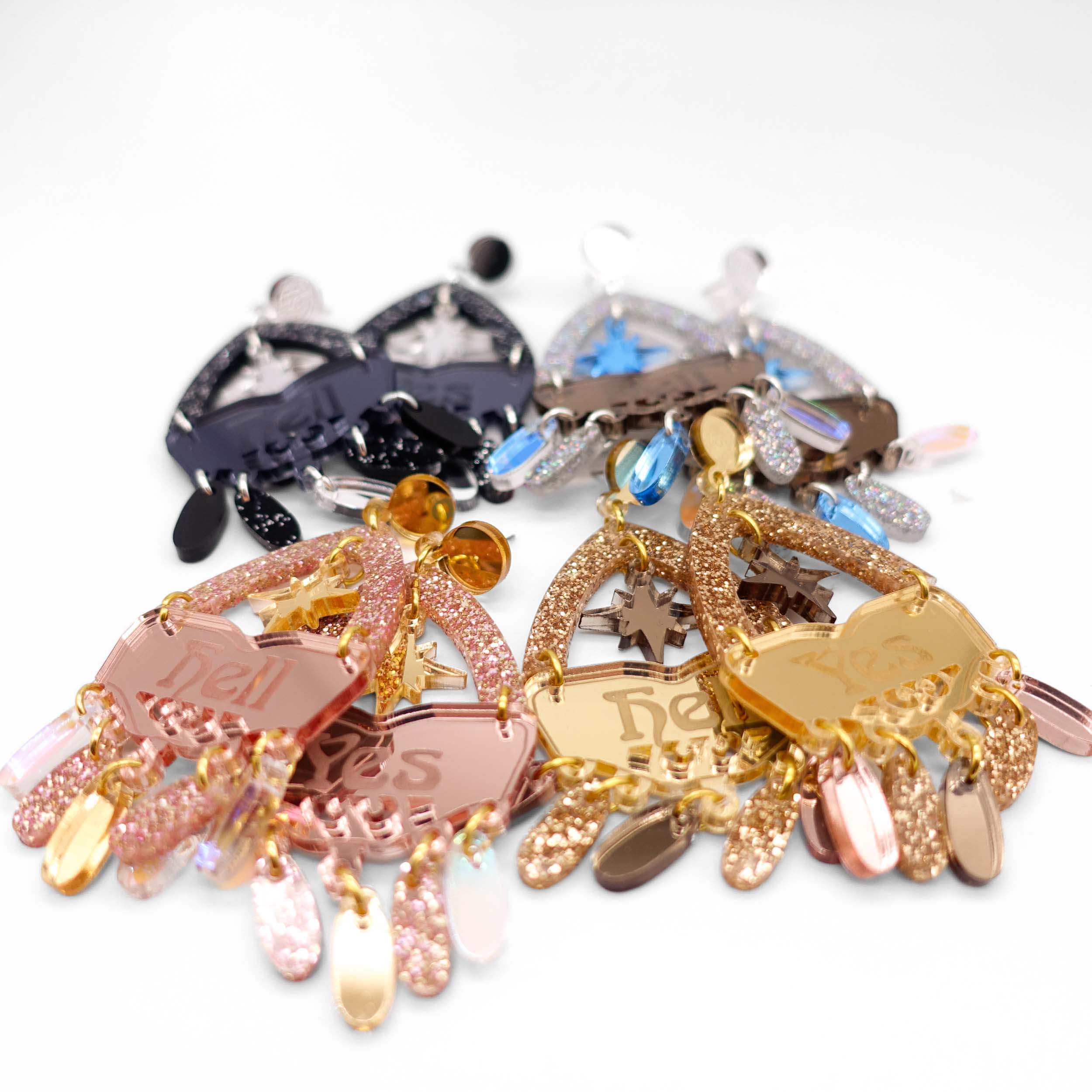 Western style Hell Yes statement earrings shown in the four different colourways.