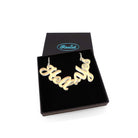 Hell Yes necklace in matte iridescent, shown in a Wear and Resist gift box.