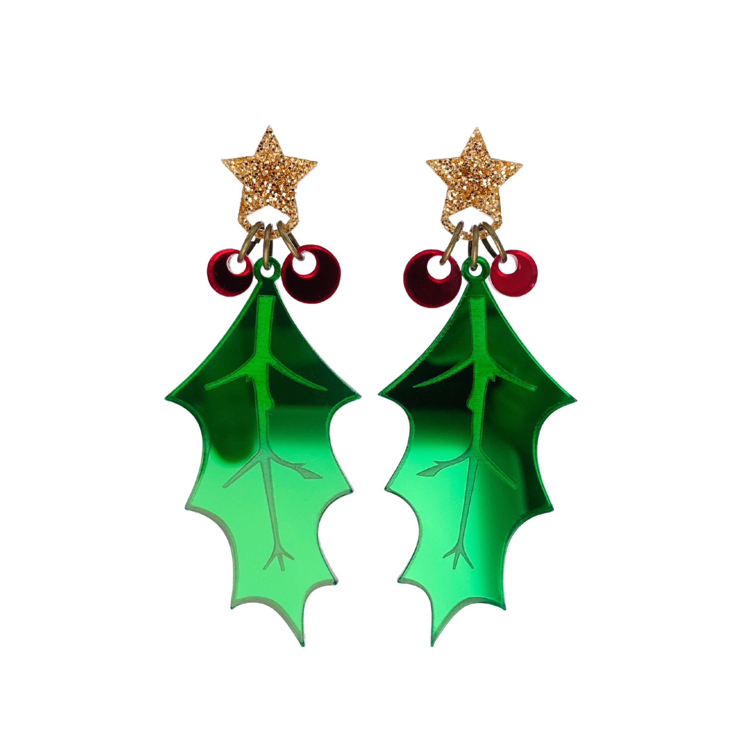 Statement holly earrings in mirror acrylic with glitter gold stars, designed by Sarah Day for the Wear and Resist Christmas collection.