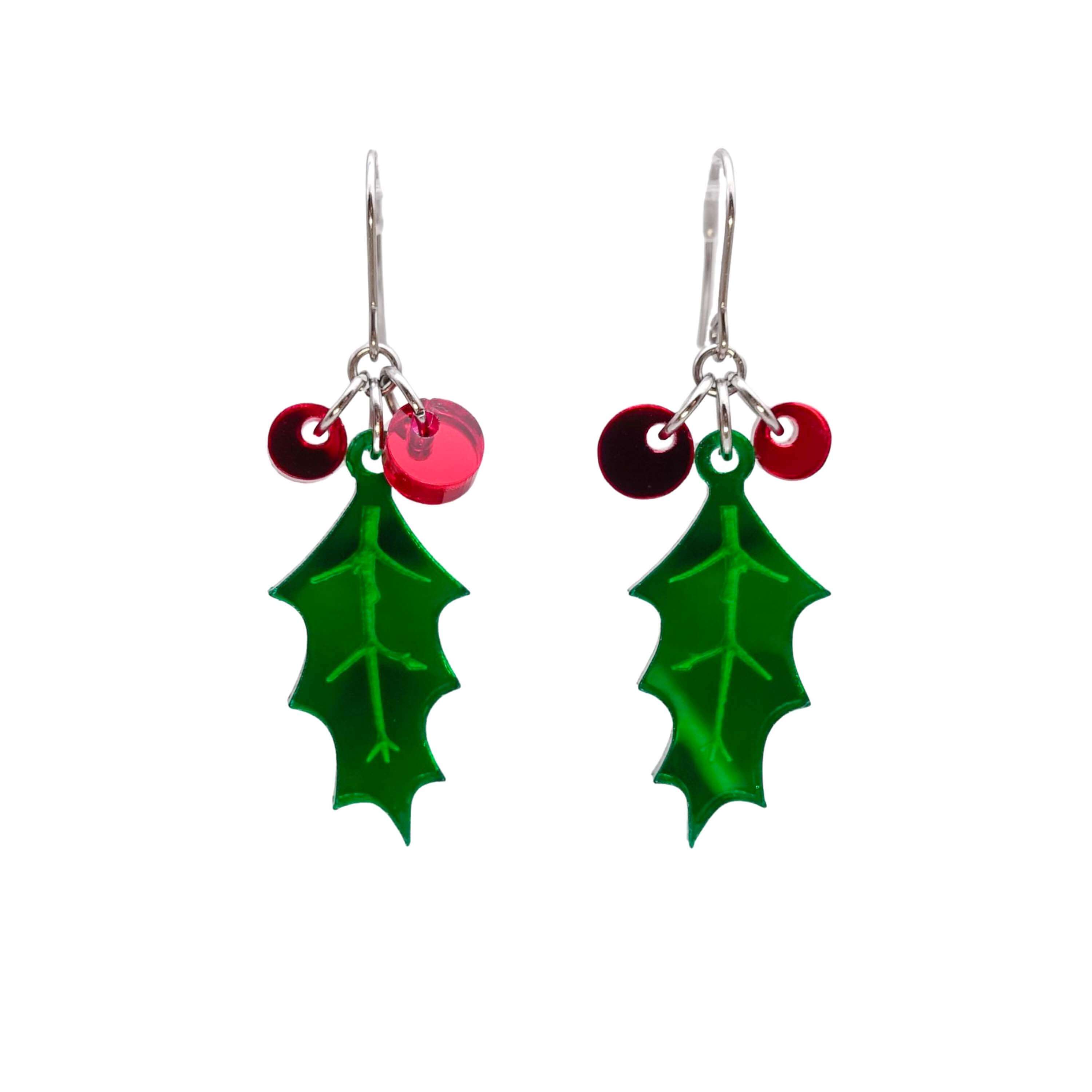 Naturalistic Holly earrings with red berries shown hanging on stainless steel ear wires against a white background.