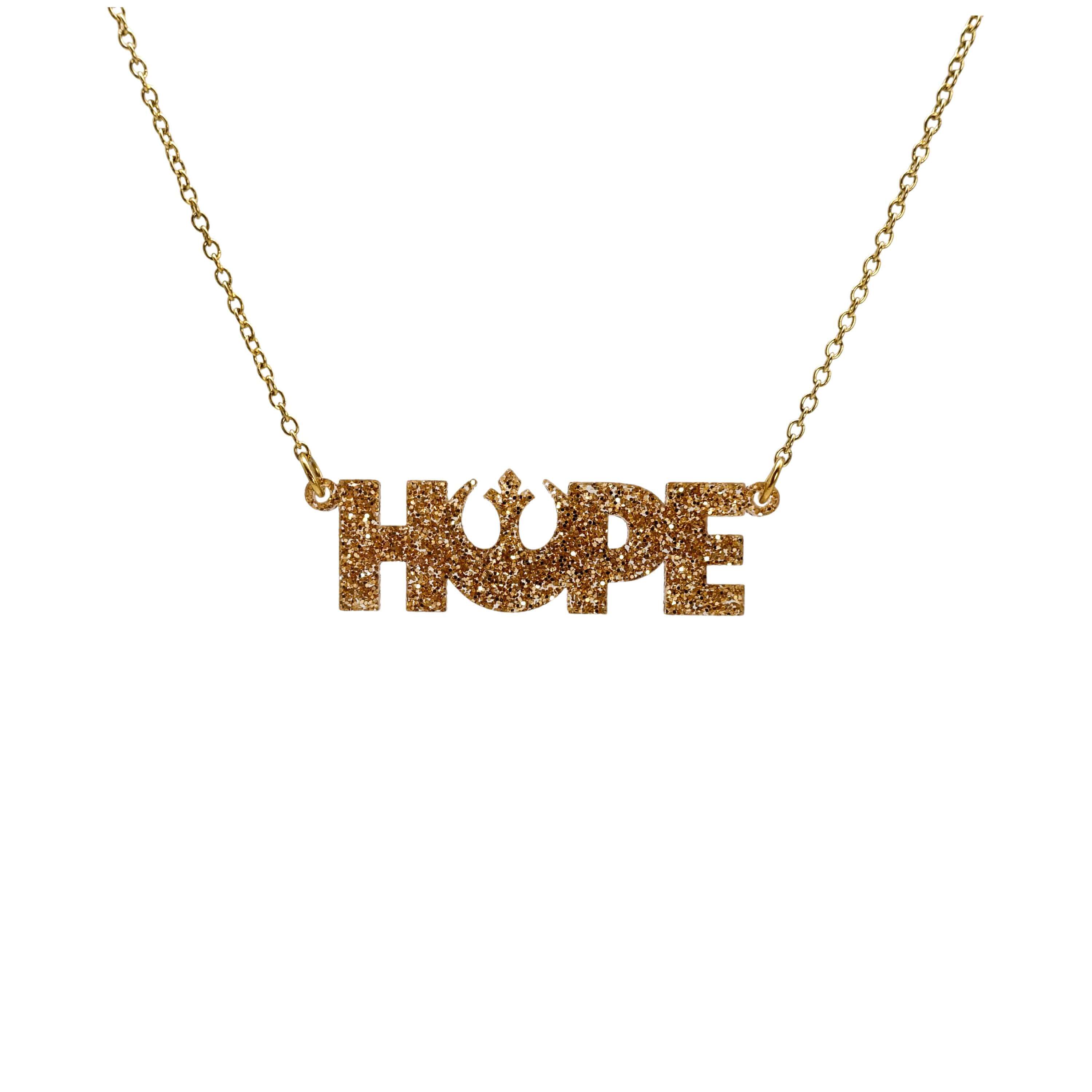 Hope necklace with Rebel Alliance symbol in gold glitter shown hanging on a gold-plated stainless steel chain against a white background.