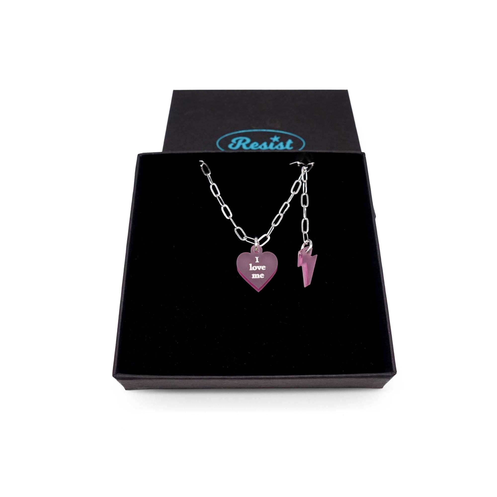 Delicate I love me glow in the dark choker and bracelet in pink.