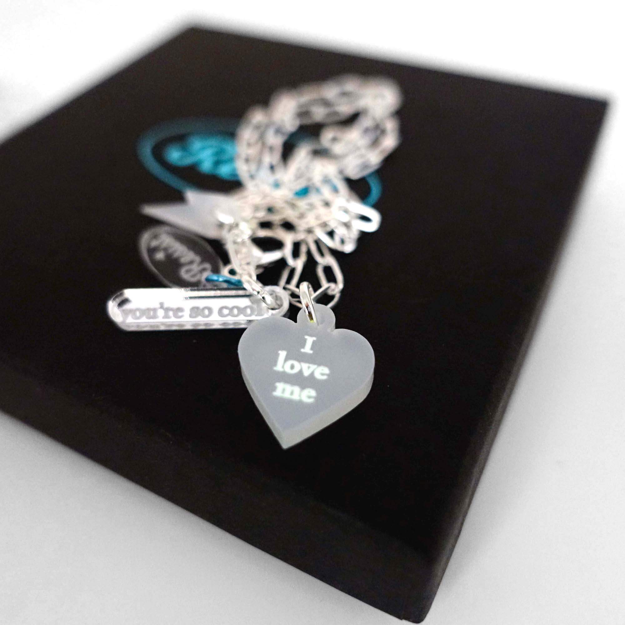 I love me glow in the dark choker and bracelet in secret white. Almost invisible during the day but the words glow to be with you in the dark.