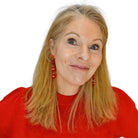 Sarah wears I Love Me earrings in red.