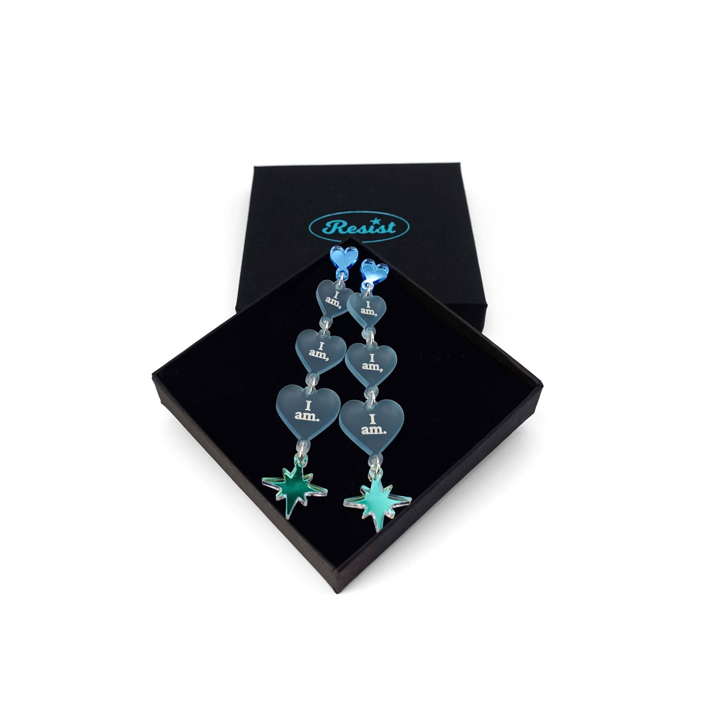 Sea foam  I am I am I am heart drop earrings shown in a Wear and Resist gift box.