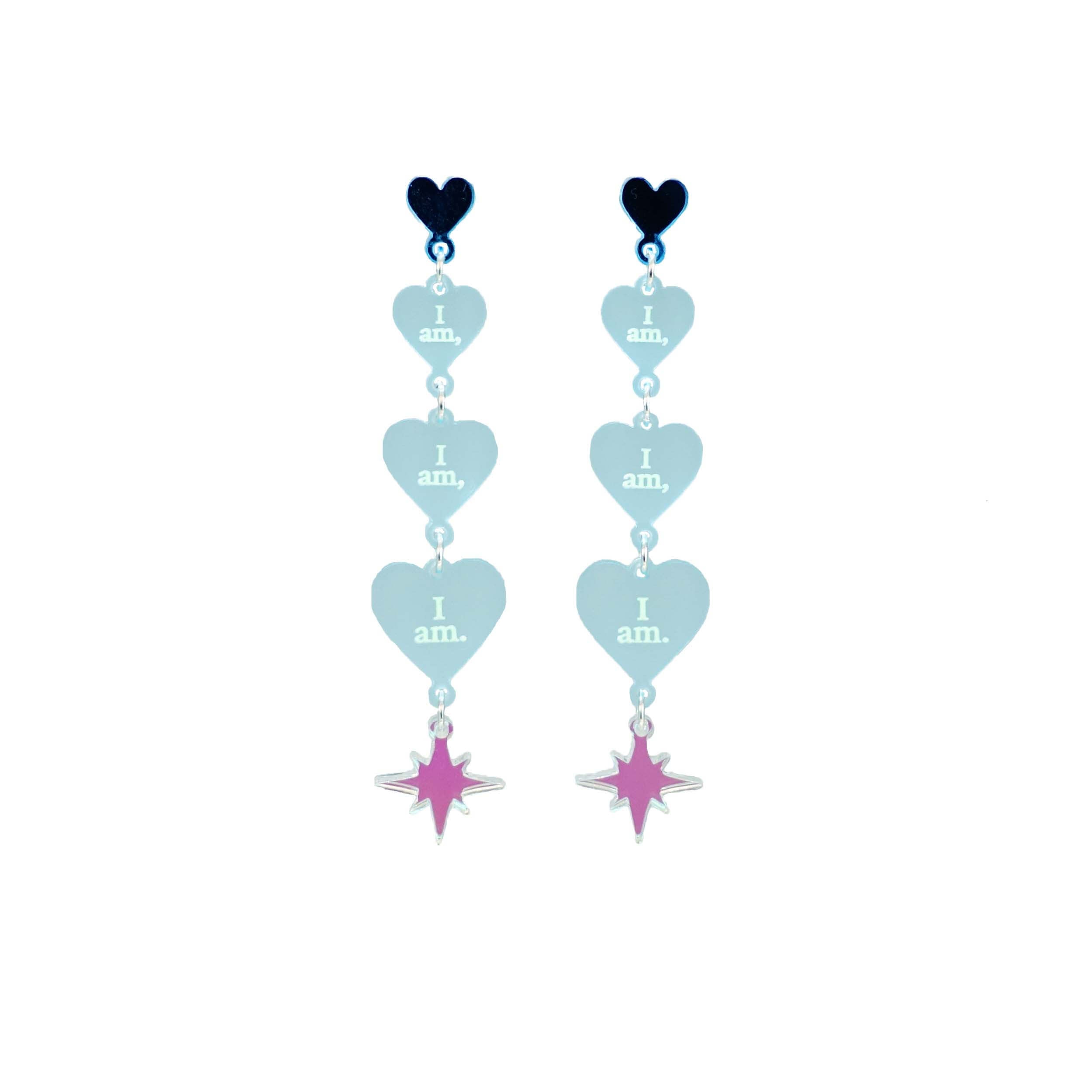 Sea foam frost  I am I am I am heart drop earrings finished with an iridescent star. Shown hanging against a white background.
