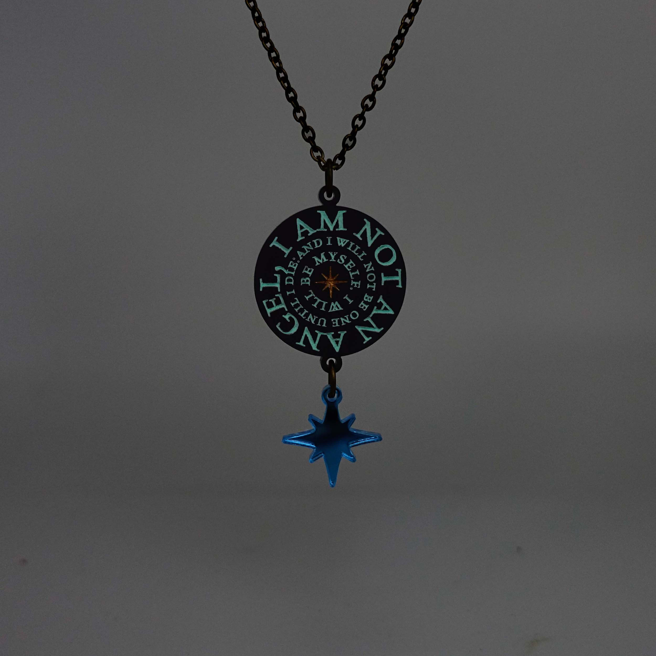 The I am not an angel Jane Eyre pendant shown glowing in the dark.
