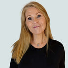 Sarah Day, Founder of Wear and Resist, wears the I Love Me necklace as a choker.