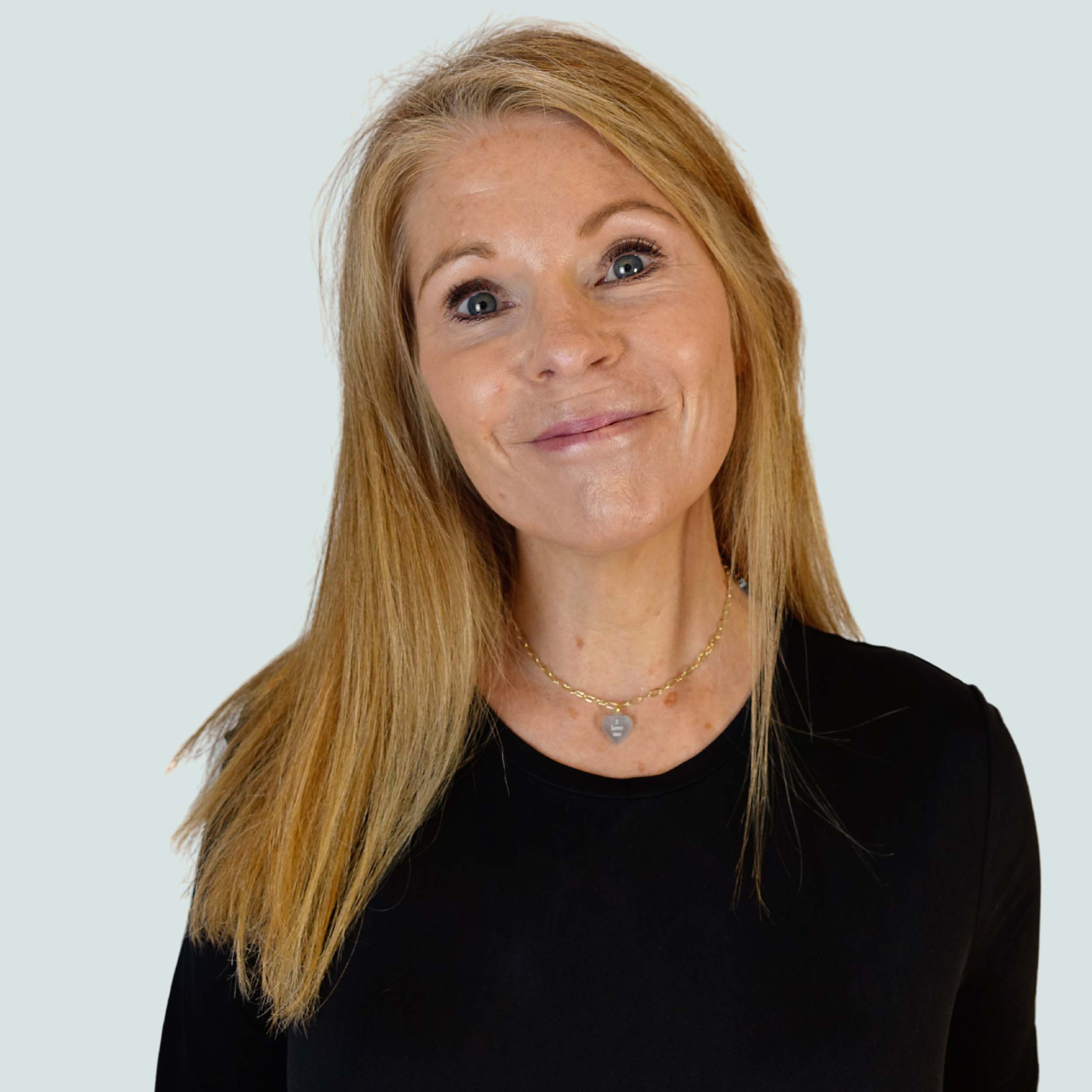 Sarah Day, Founder of Wear and Resist, wears the I Love Me necklace as a choker.