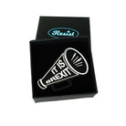 Megaphone brooch etched with 'It is Brexit' in glow-in-the-dark pigment. Shown in a small Wear and Resist gift box.