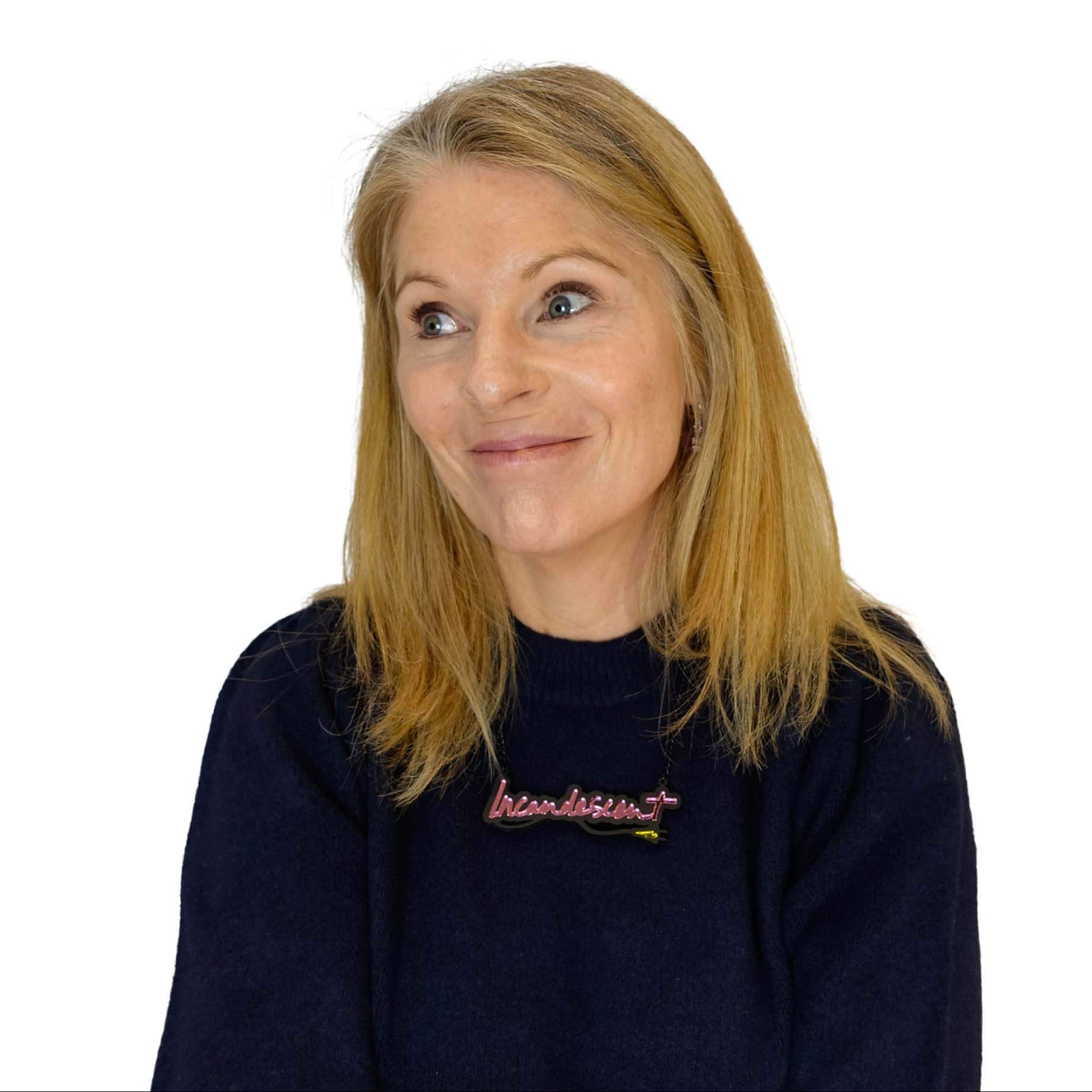 Sarah Day, founder of Wear and Resist wears a pink Incandescent necklace, expressing the rage and inspired by Tracey Emin's neon work.