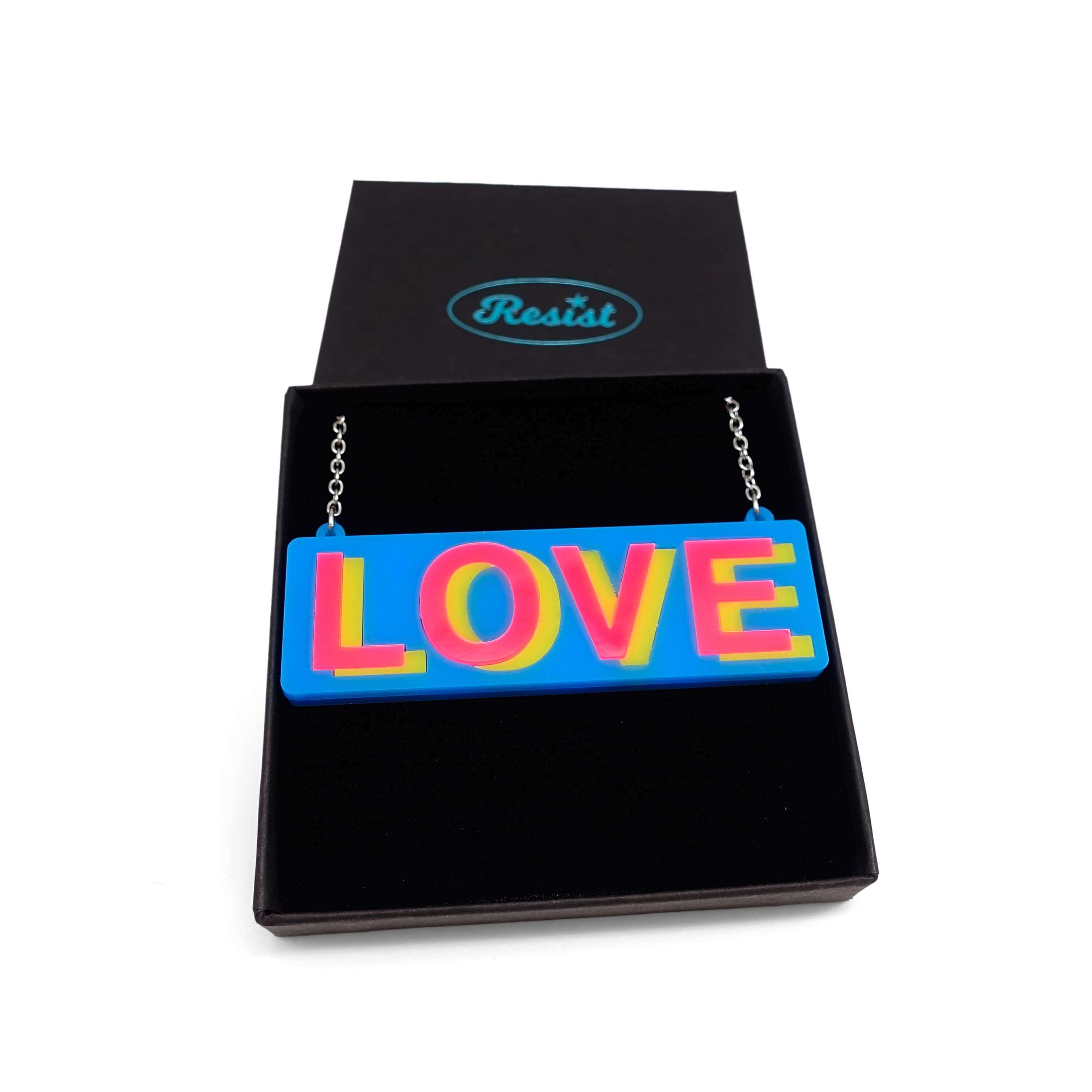 LOVE necklace in colourful blue, hot pink and yellow, shown in a Wear and Resist gift box.