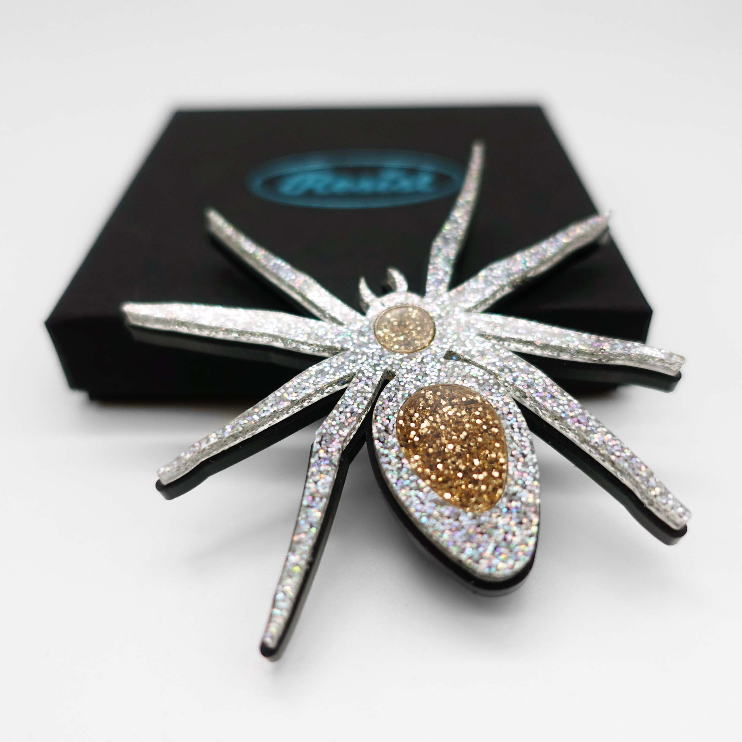 All Hail Lady Hail Spider brooch, designed by Sarah Day in 2019 in honour of Lady Hale's infamous spider brooch. £2 goes to Women for Refugee Women.