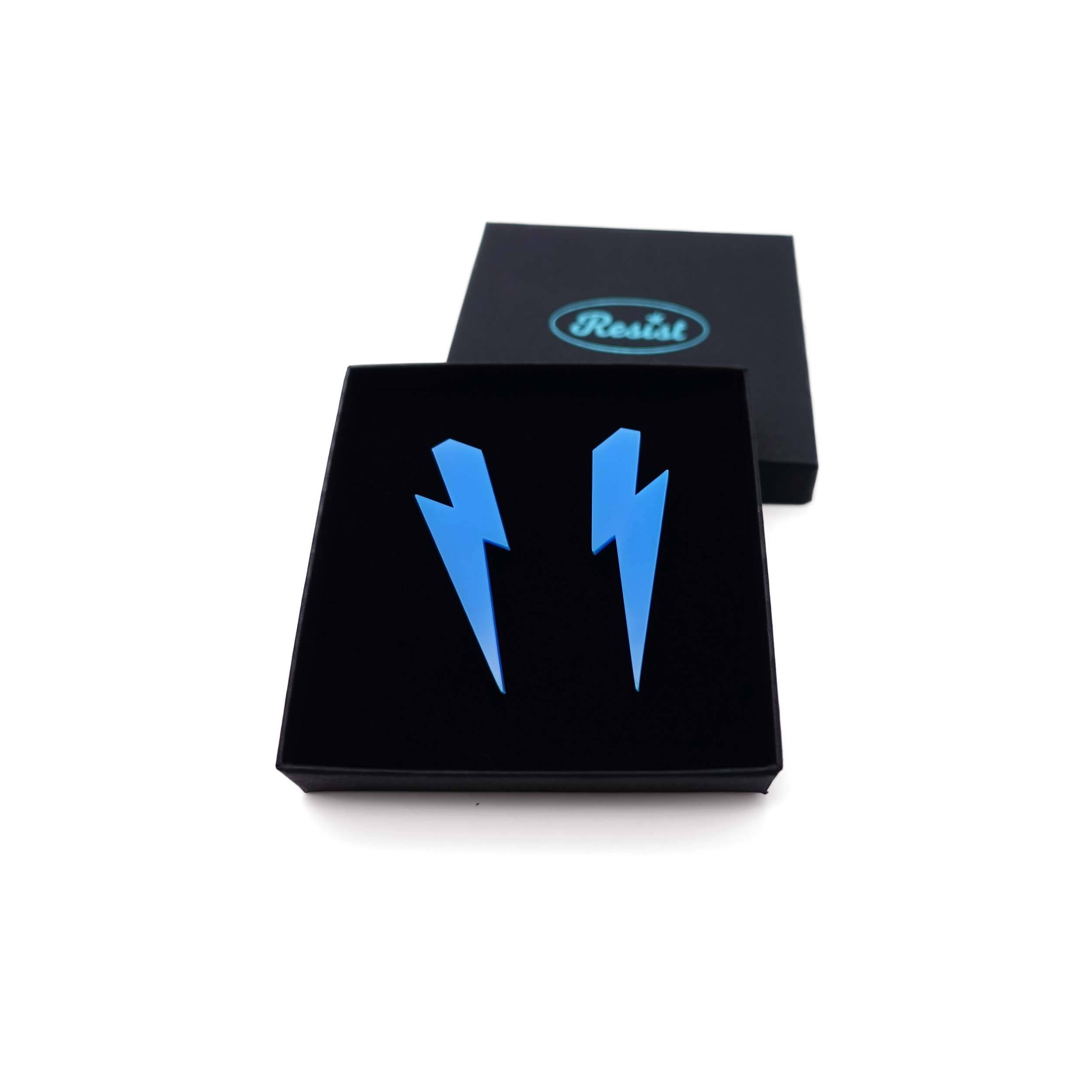 Large Lightning Bolt earrings in Matisse blue, shown in a Wear and Resist gift box.