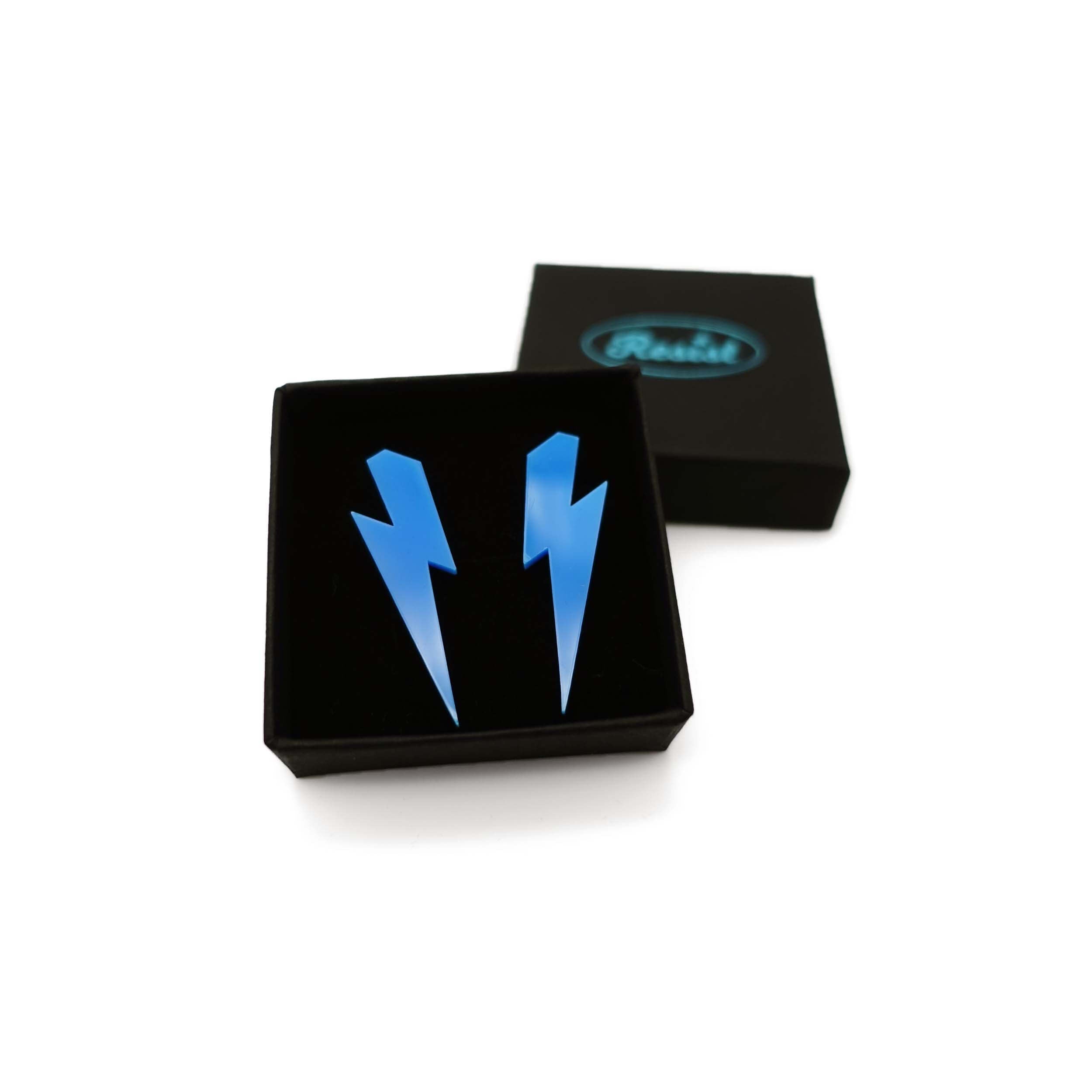 Medium Lightning Bolt earrings in Matisse blue, shown in a small Wear and Resist gift box.