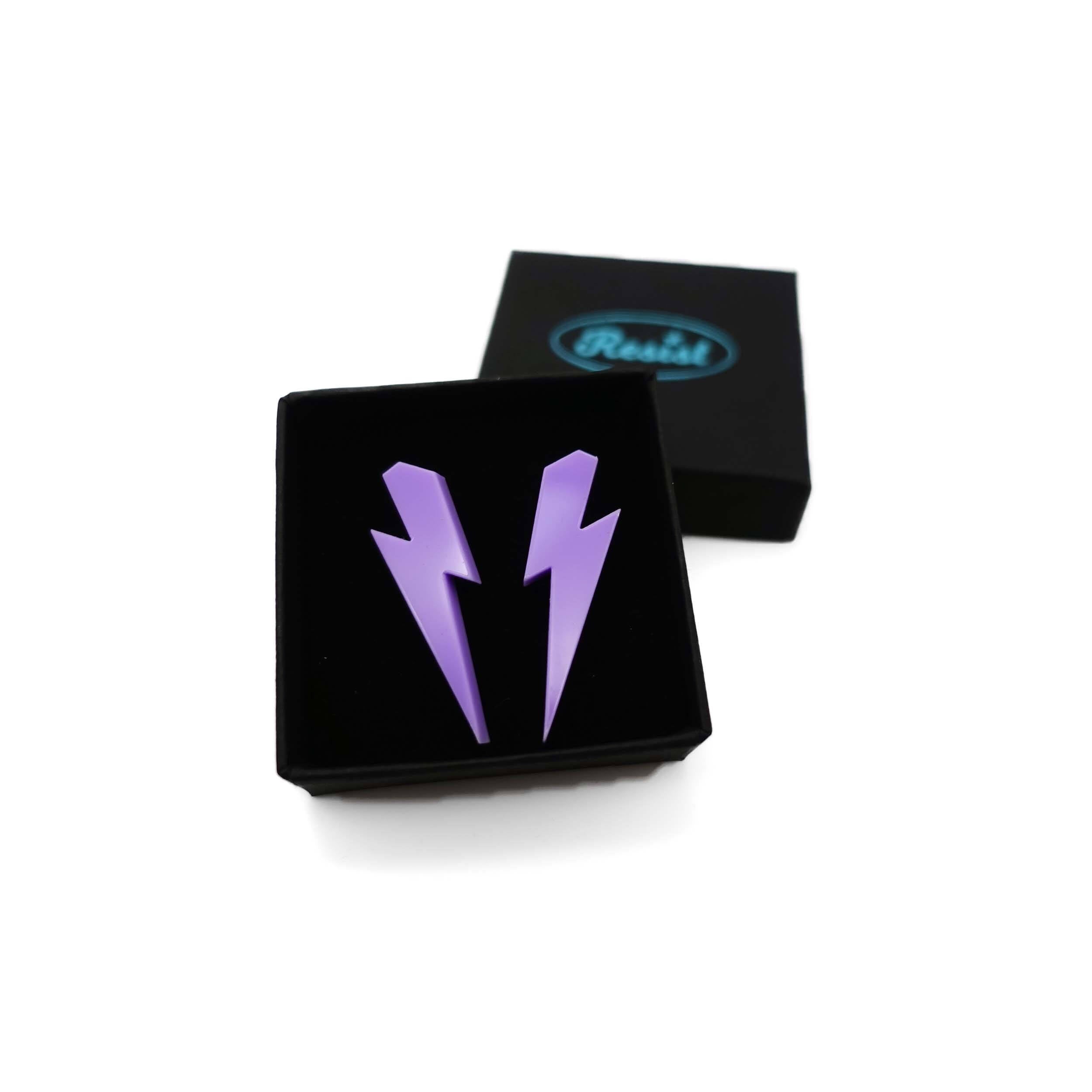 Medium Lightning Bolt earrings in parma violet, shown in a small Wear and Resist gift box.