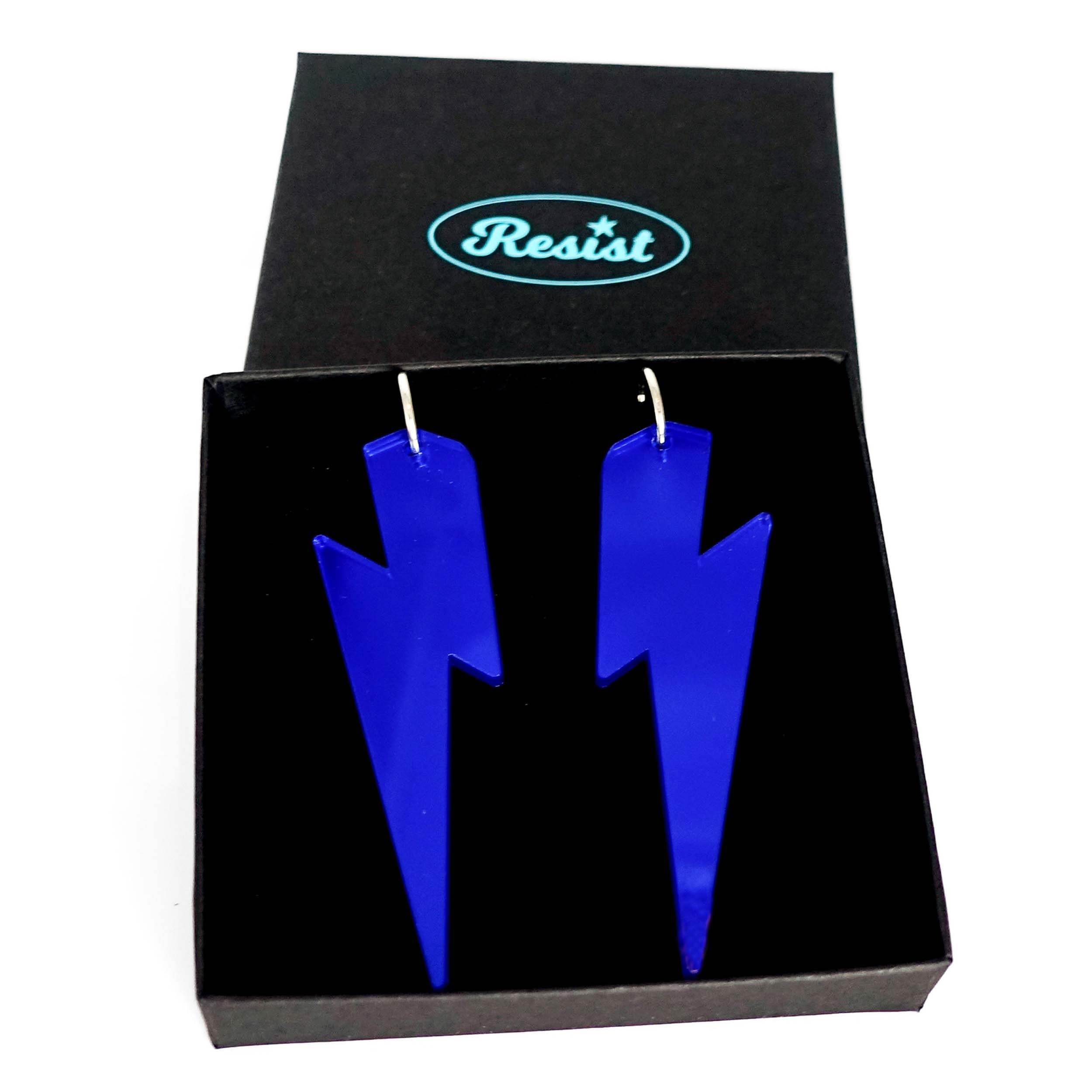 Massive Lightning Bolt hoop earrings in electric blue mirror, shown in a Wear and Resist gift box.