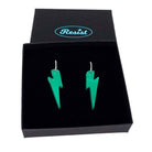 Electric green mirror medium Lightning Bolt earrings on silver hoops, shown in a Wear and Resist gift box.