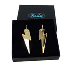 Large Lightning Bolt hoop earrings in gold mirror, shown in a Wear and Resist gift box.