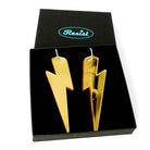 Massive Lightning Bolt hoop earrings in gold mirror, shown in a Wear and Resist gift box.