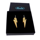 Gold mirror medium Lightning Bolt earrings on silver hoops, shown in a Wear and Resist gift box.