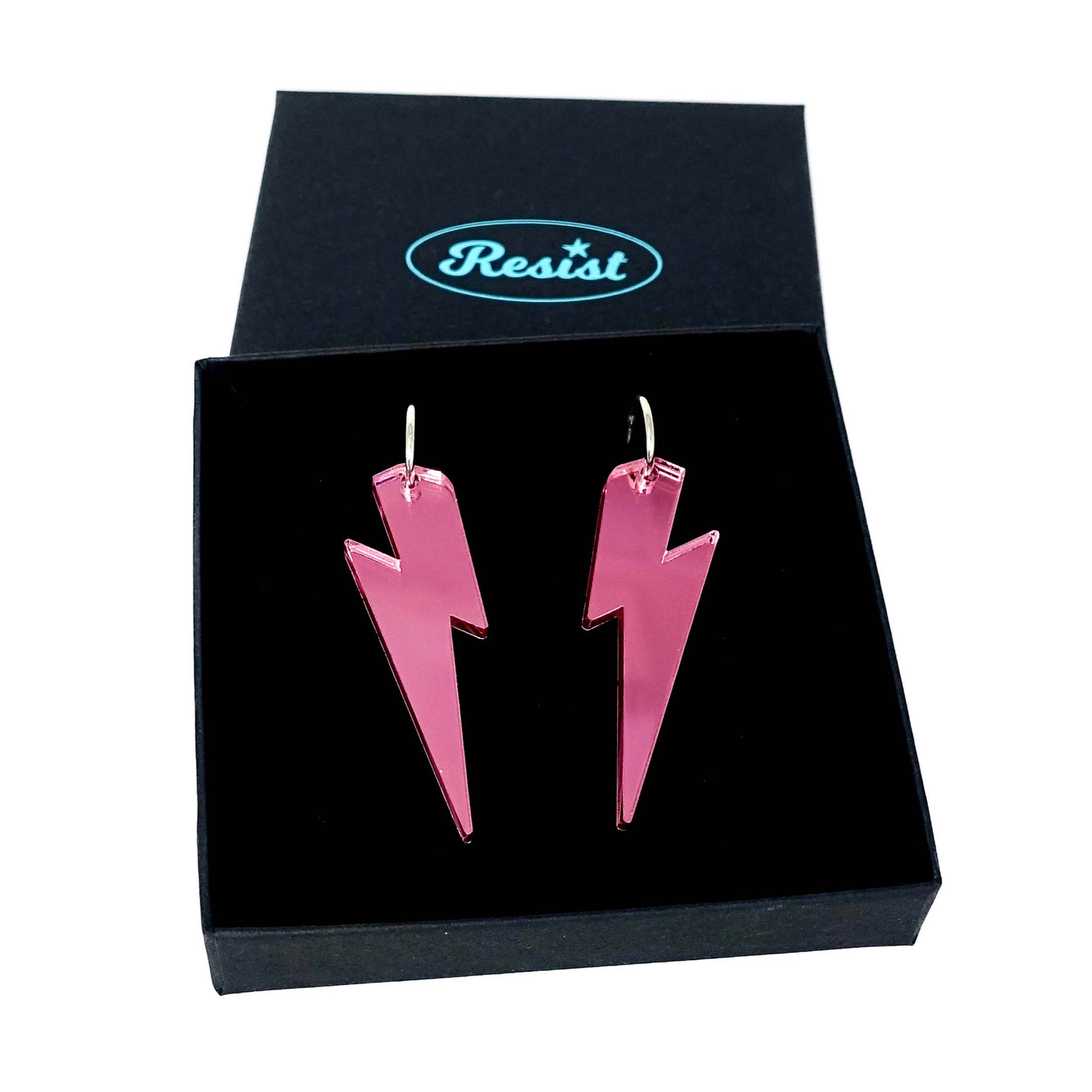 Large Lightning Bolt hoop earrings in pink mirror, shown in a Wear and Resist gift box.