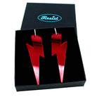 Massive Lightning Bolt hoop earrings in ruby mirror, shown in a Wear and Resist gift box.
