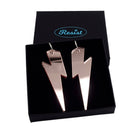 Massive Lightning Bolt hoop earrings in rose gold mirror, shown in a Wear and Resist gift box.