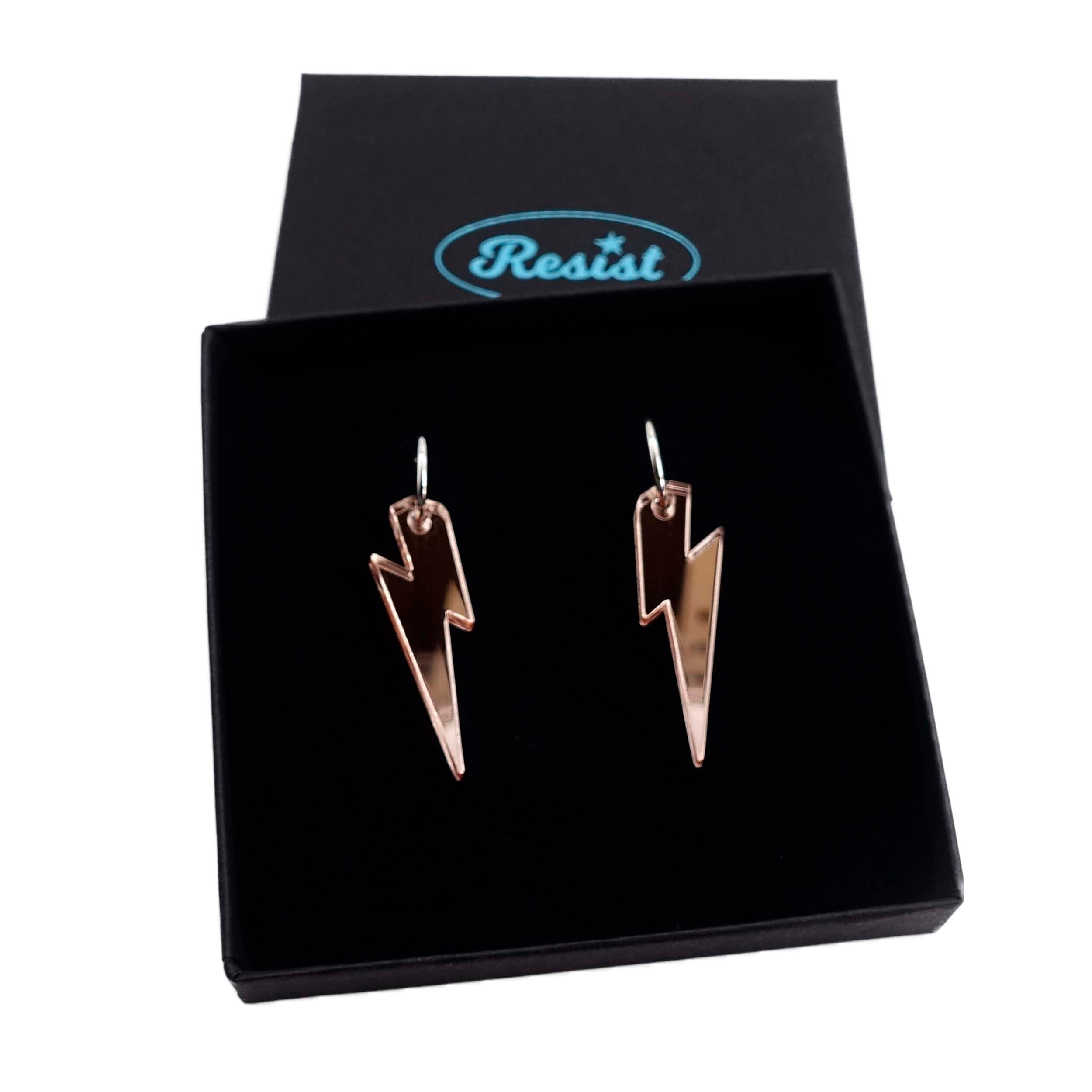 Rose gold mirror medium Lightning Bolt earrings on silver hoops, shown in a Wear and Resist gift box.