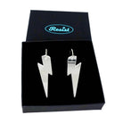 Large Lightning Bolt hoop earrings in silver mirror, shown in a Wear and Resist gift box.