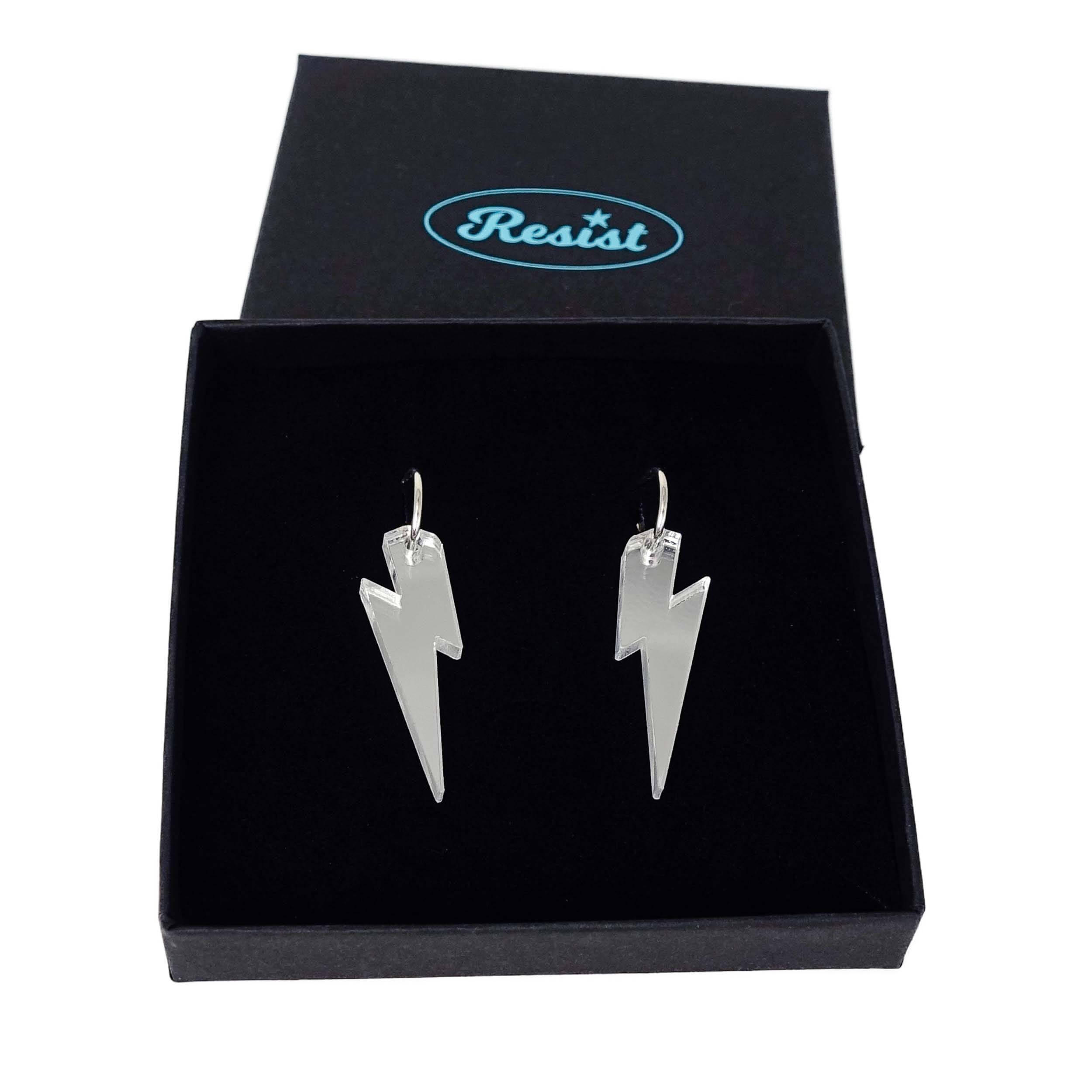 Silver mirror medium Lightning Bolt earrings on silver hoops, shown in a Wear and Resist gift box.