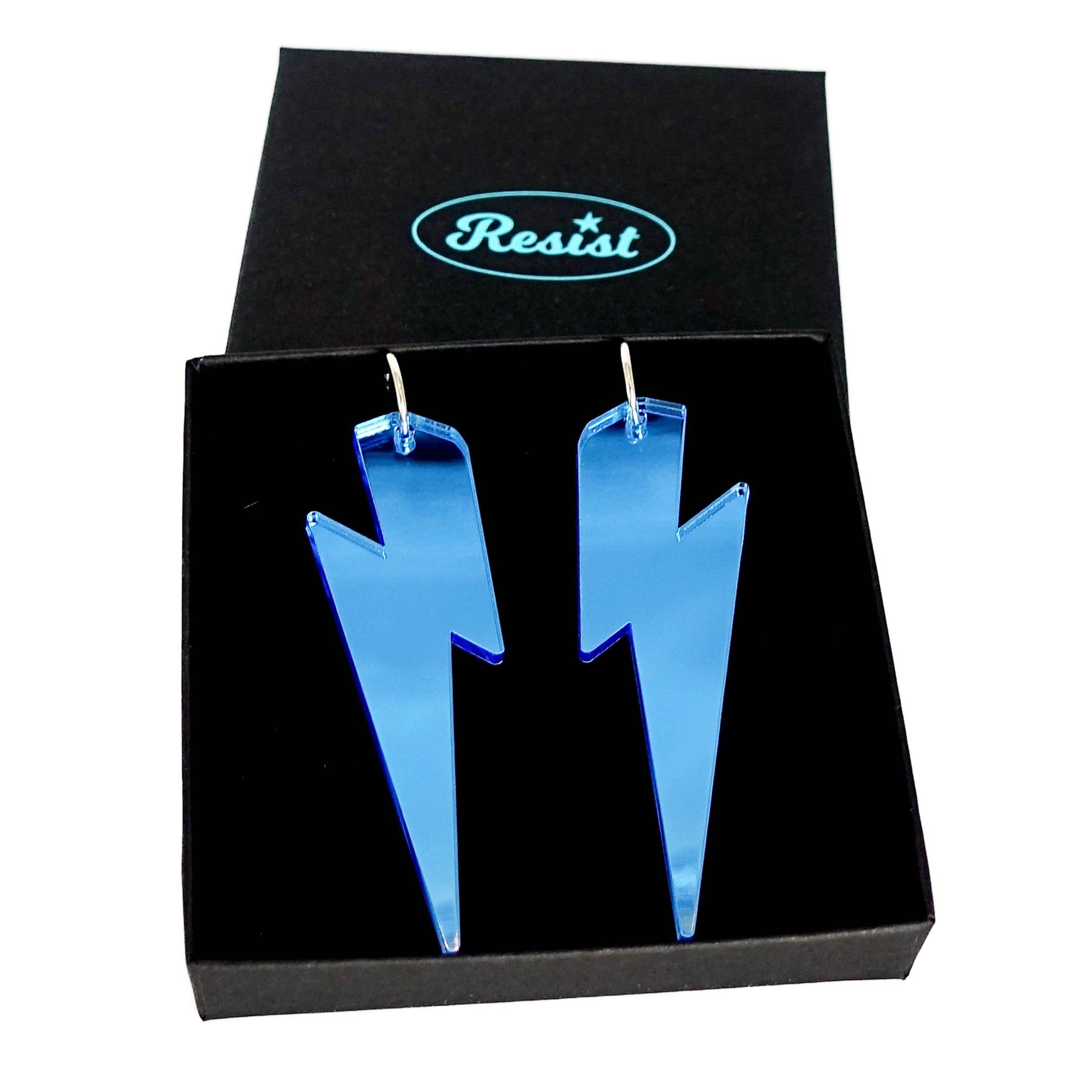 Massive Lightning Bolt hoop earrings in sky mirror, shown in a Wear and Resist gift box.