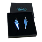Sky mirror medium Lightning Bolt earrings on silver hoops, shown in a Wear and Resist gift box.