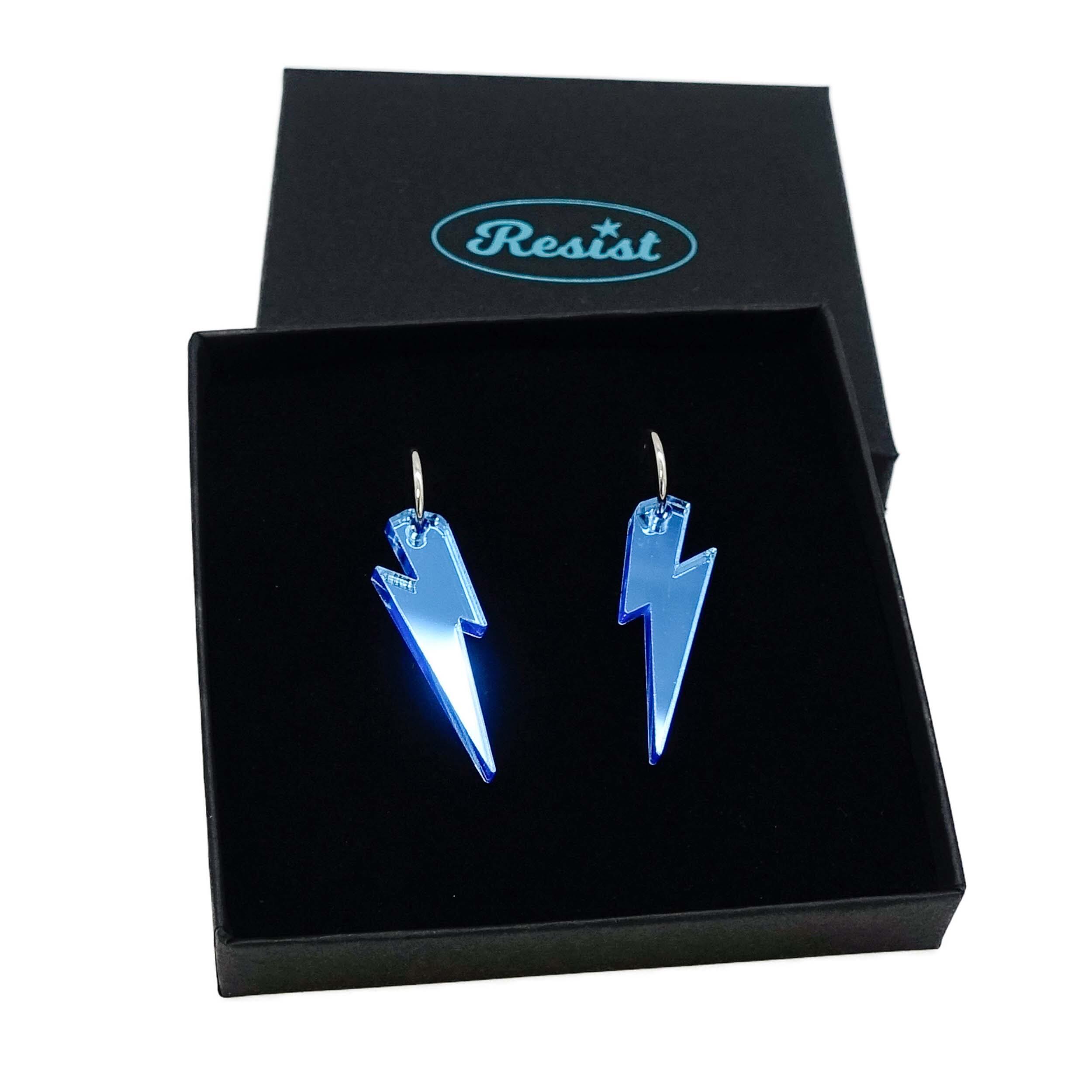 Sky mirror medium Lightning Bolt earrings on silver hoops, shown in a Wear and Resist gift box.