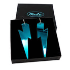 Massive Lightning Bolt hoop earrings in teal mirror, shown in a Wear and Resist gift box.