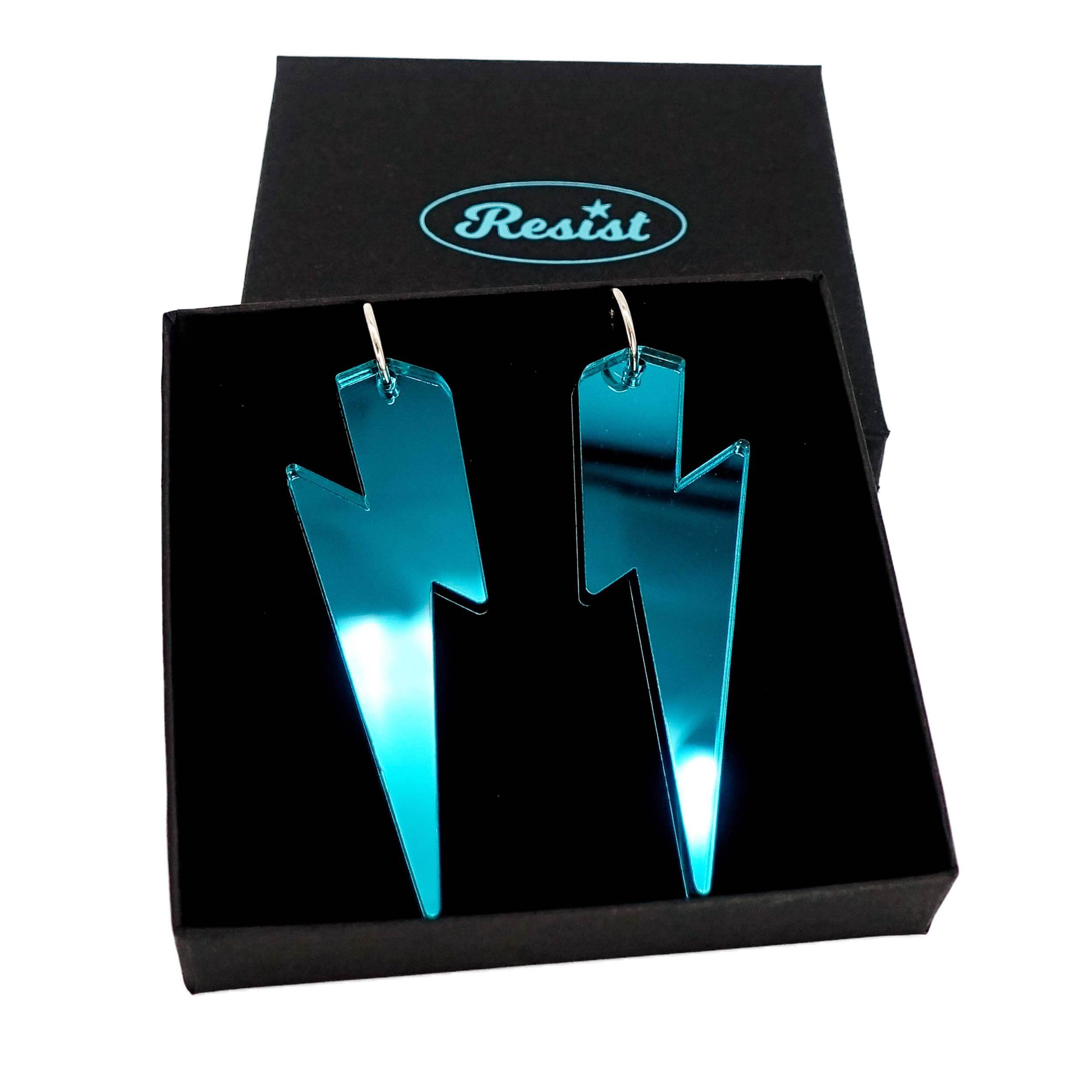 Massive Lightning Bolt hoop earrings in teal mirror, shown in a Wear and Resist gift box.