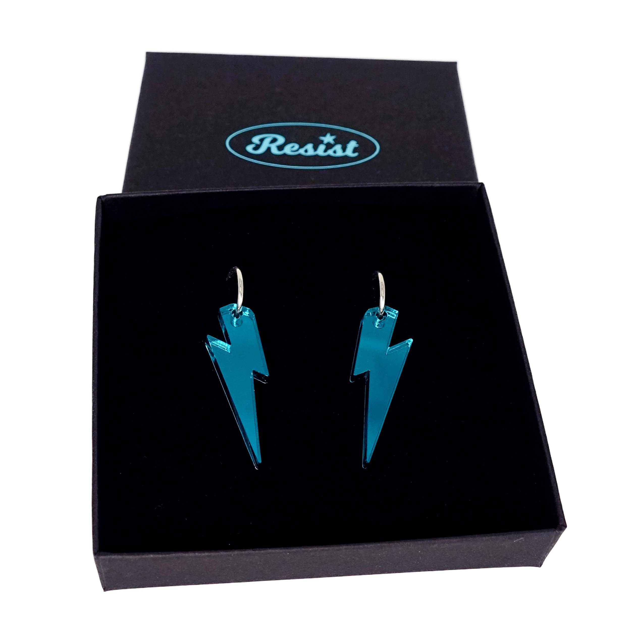 Teal mirror medium Lightning Bolt earrings on silver hoops, shown in a Wear and Resist gift box.