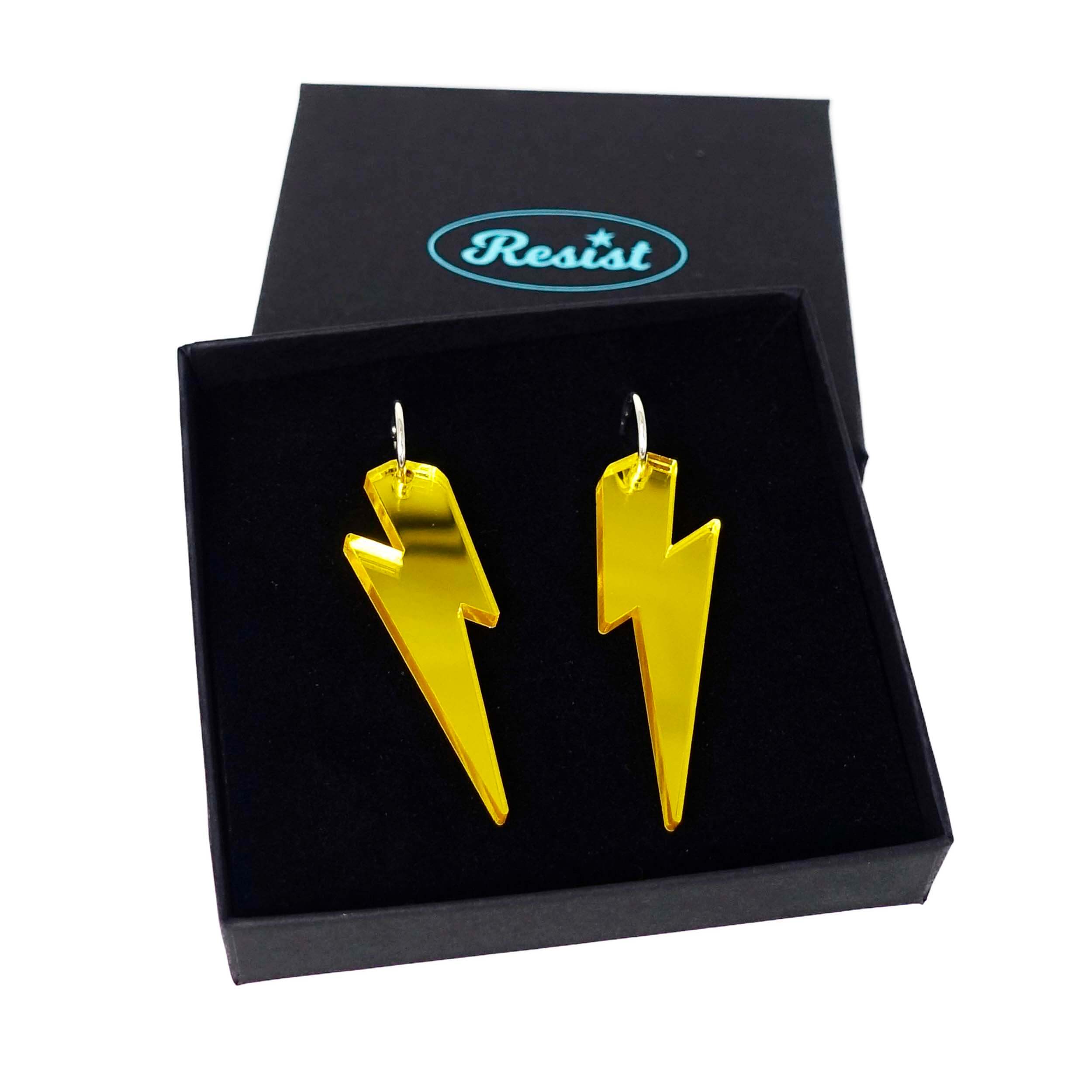 Large Lightning Bolt hoop earrings in yellow mirror, shown in a Wear and Resist gift box.