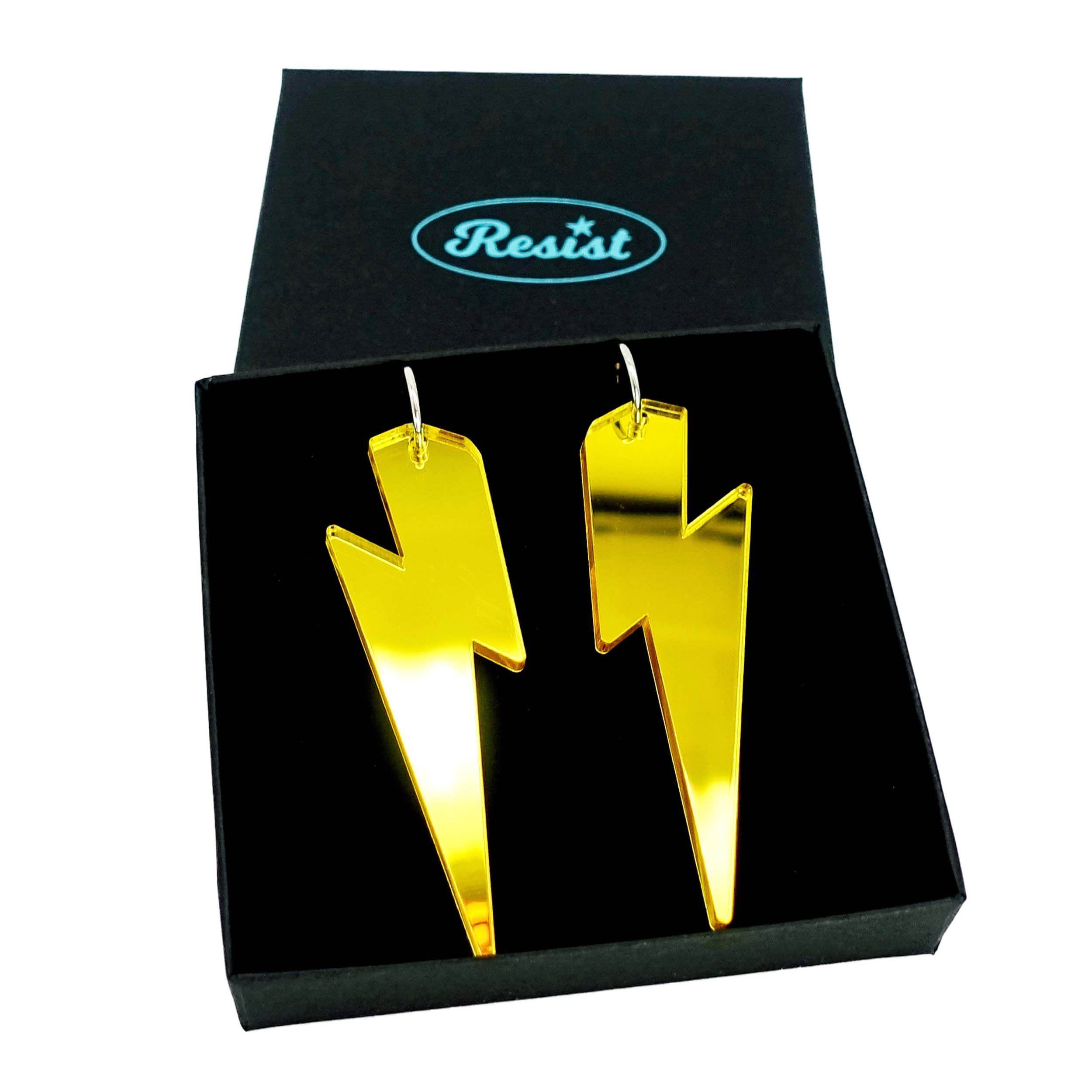 Massive Lightning Bolt hoop earrings in yellow mirror, shown in a Wear and Resist gift box.