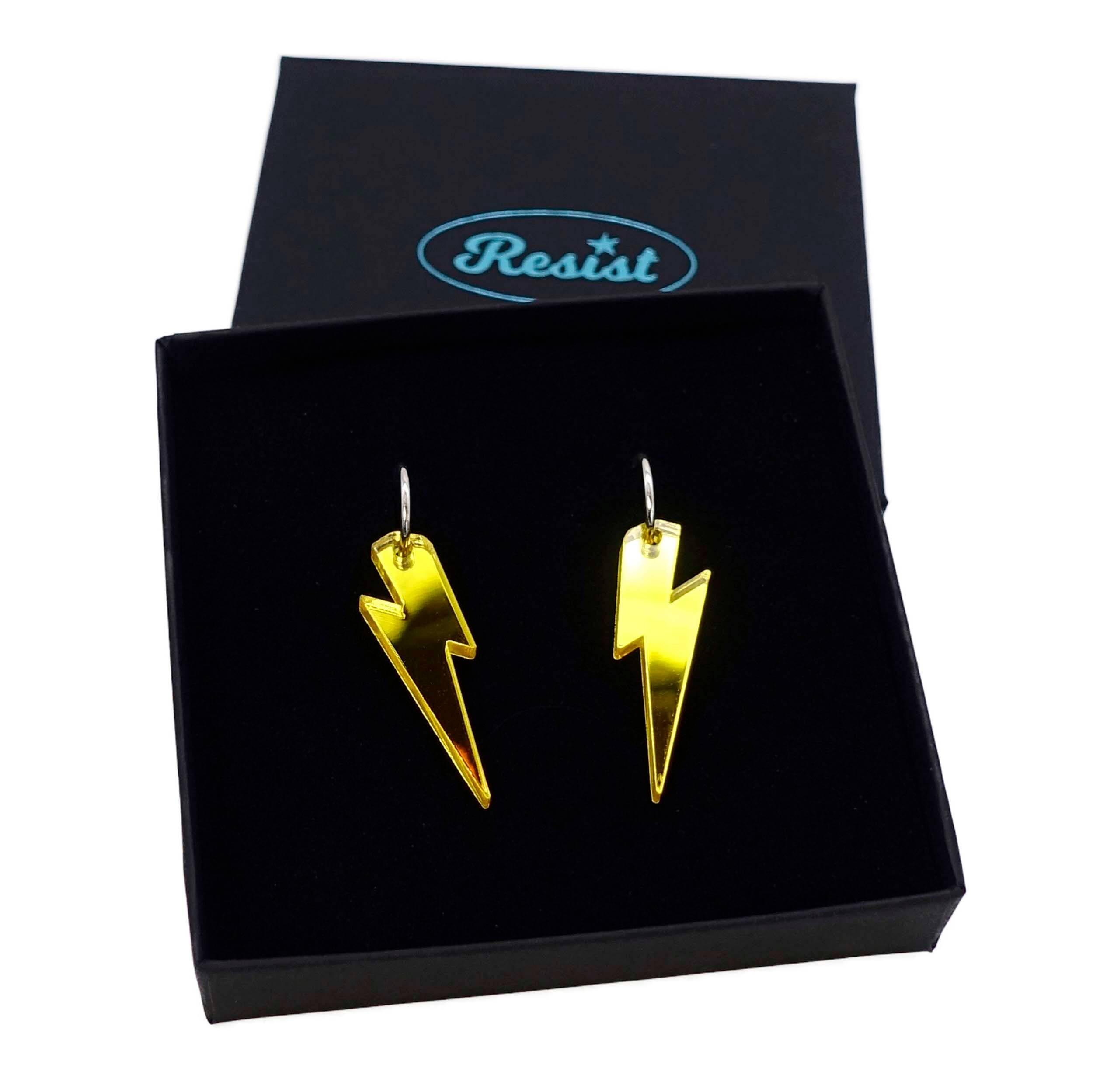 Yellow mirror medium Lightning Bolt earrings on silver hoops, shown in a Wear and Resist gift box.