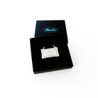 Literary Quote necklace etched with a quote by Audre Lorde, 'I am deliberate and afraid of nothing.' Shown in a Wear and Resist gift box.