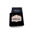 The lyrics of the Specials immortalised on a bronze Mirror Cowboy necklace: It's all a load of bollocks and bollocks to it all. Shown in a small Wear and Resist gift box.