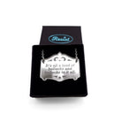 It's all a load of bollocks and bollocks to it all silver Mirror Cowboy necklace. Shown in a small Wear and Resist gift box.