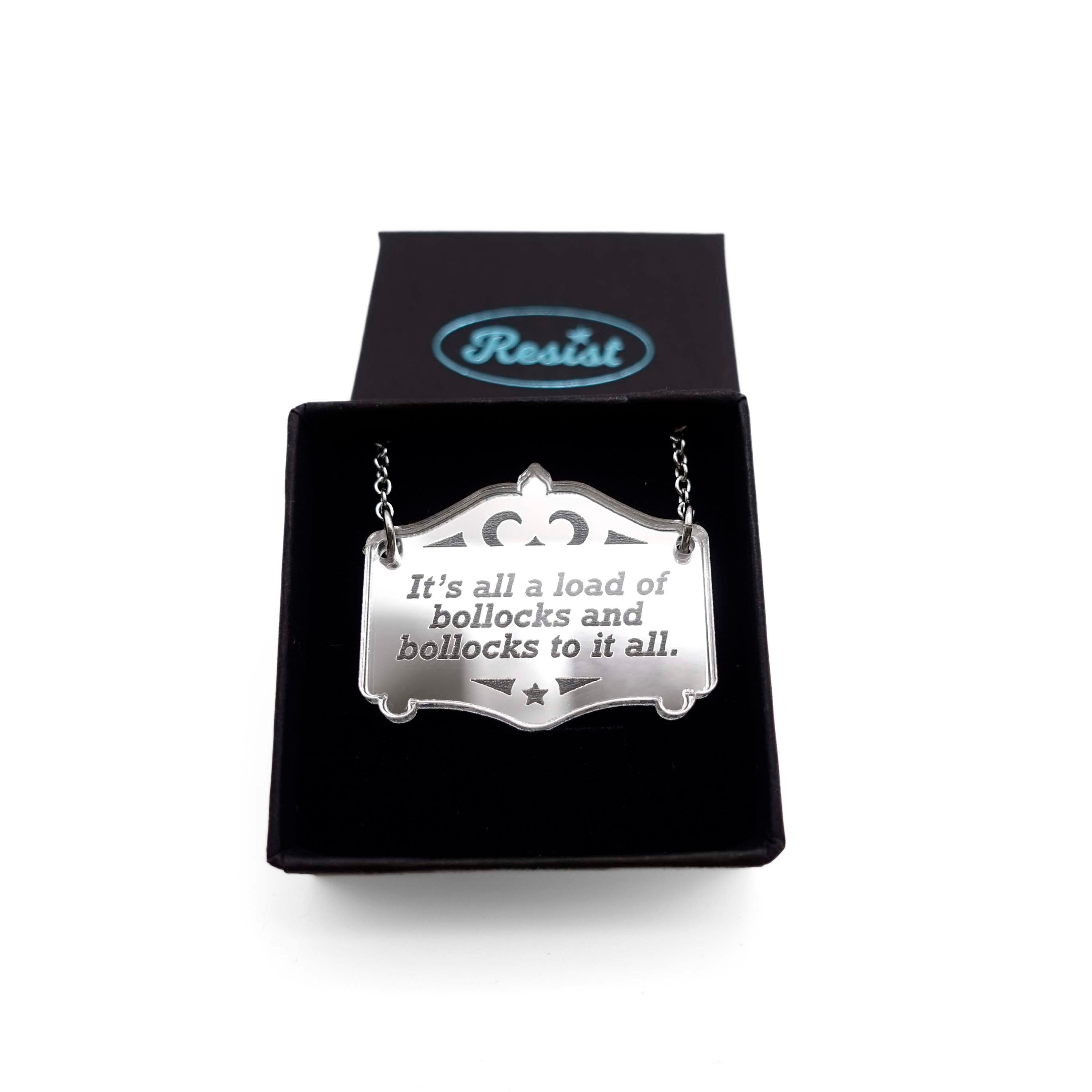 It's all a load of bollocks and bollocks to it all silver Mirror Cowboy necklace. Shown in a small Wear and Resist gift box.
