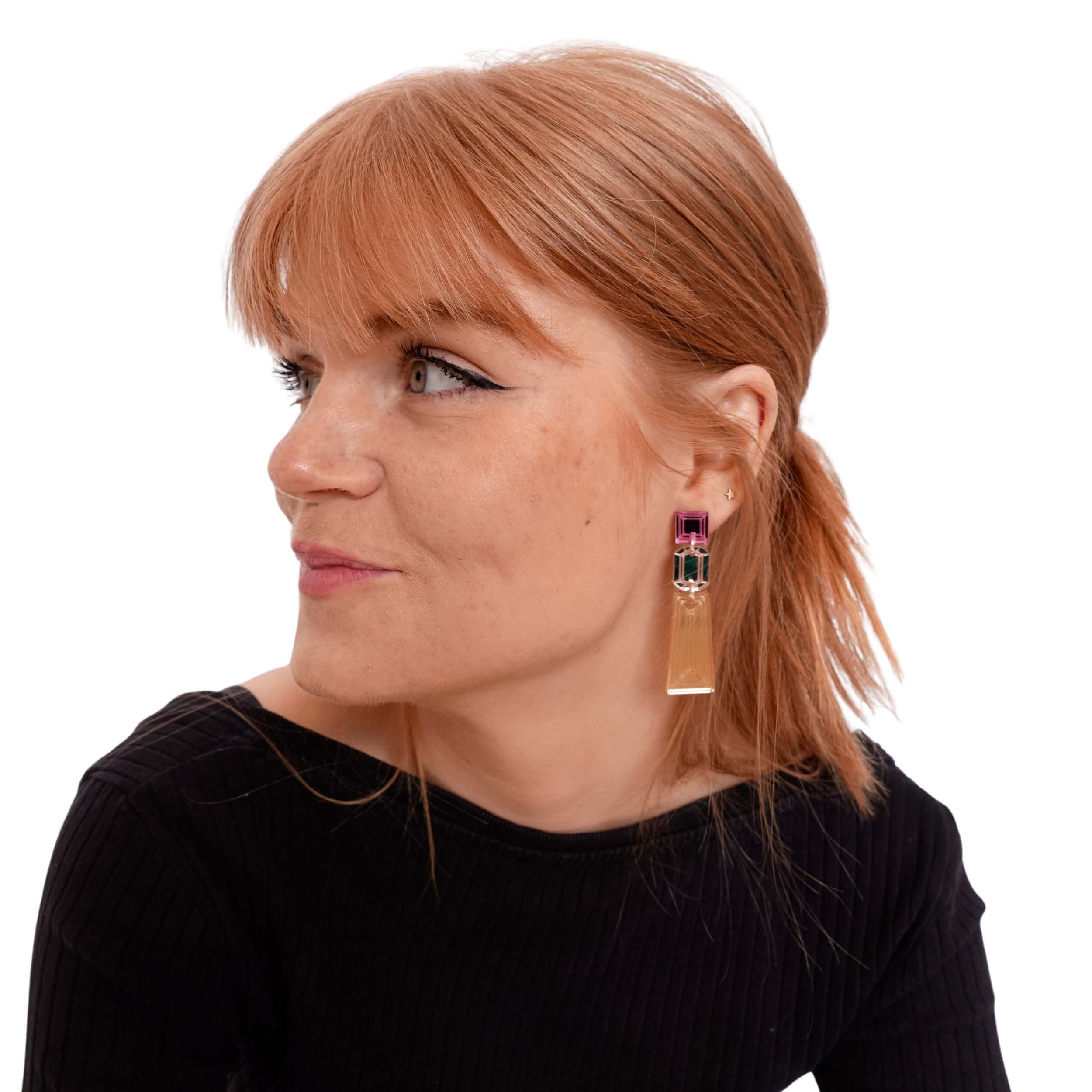 Eliza wears Long Deco Drop earrings in rose gold.